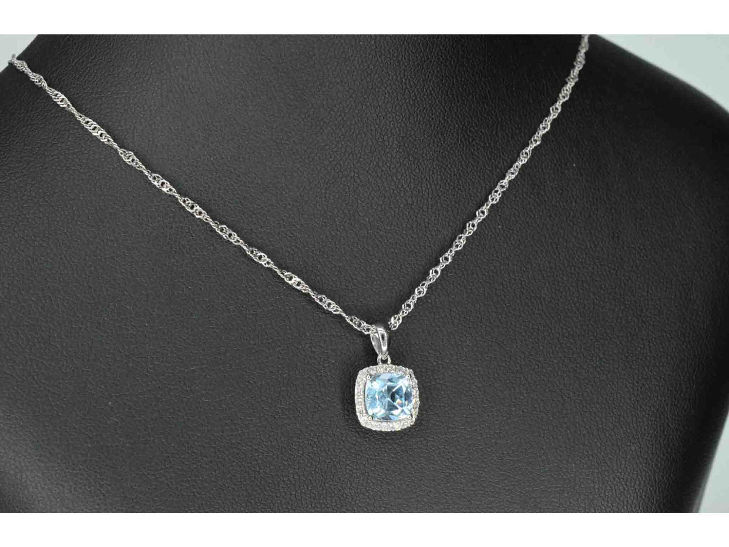 White gold entourage pendant set with topaz and diamonds