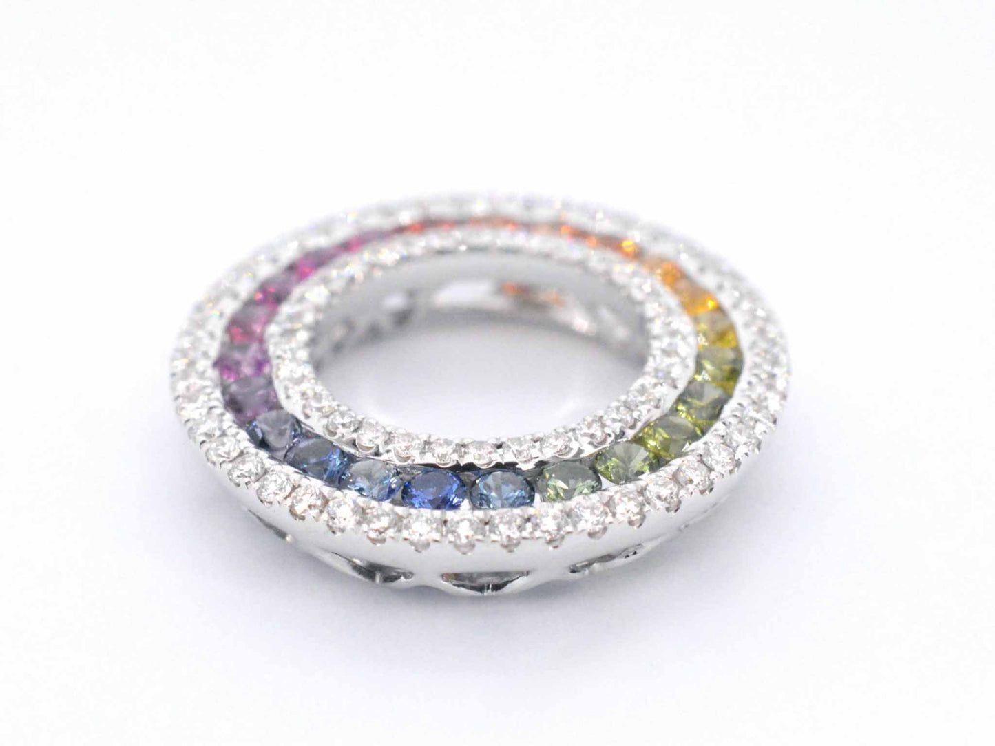 White gold pendant with multi-colored sapphires and diamonds set in a circle
