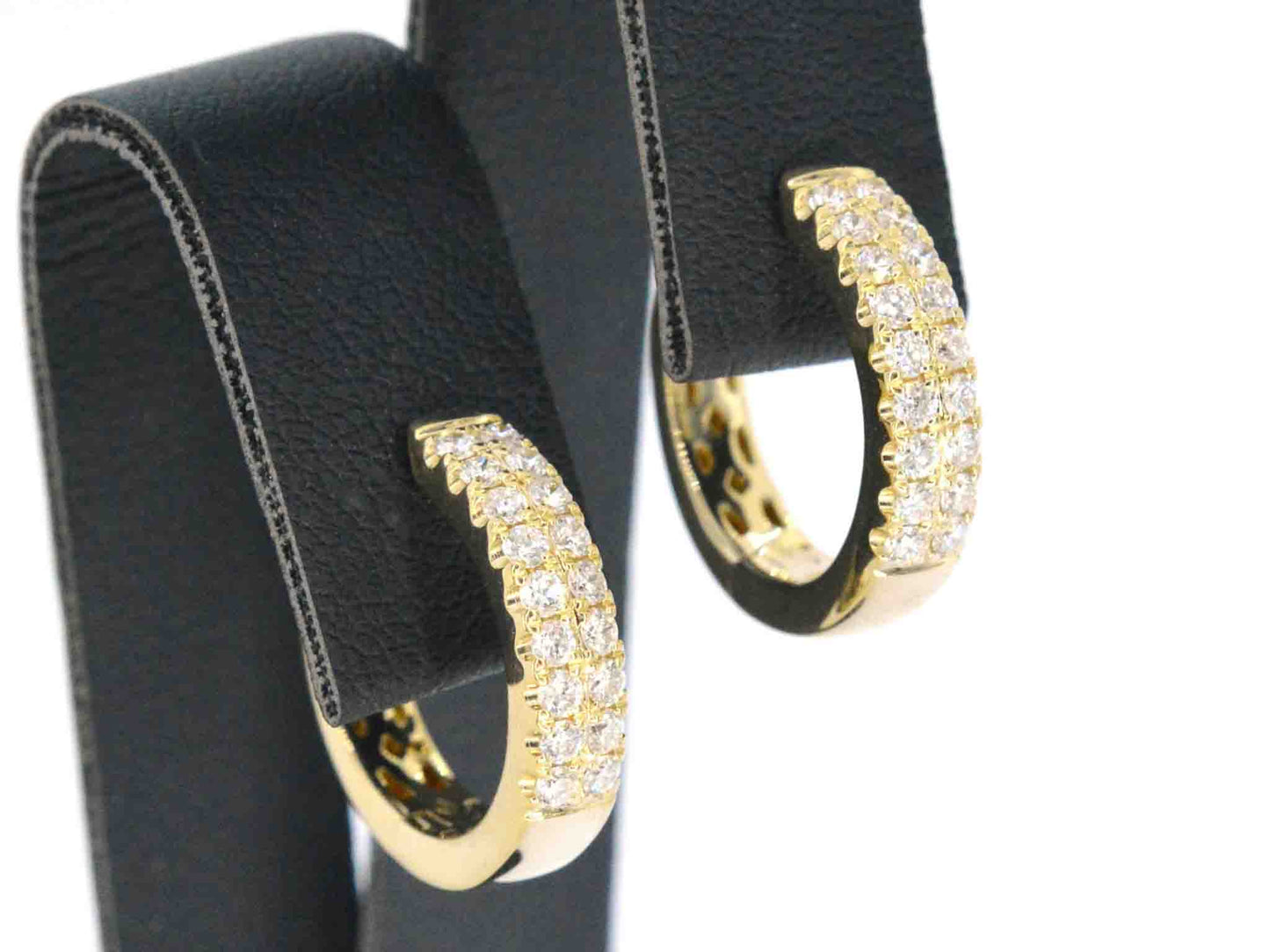 Gold hoop earrings with two rows of diamonds