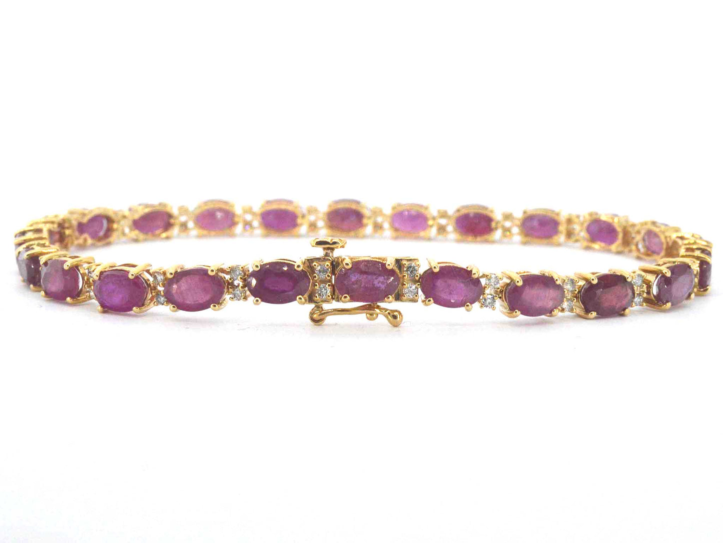 Gouden tennisarmband met diamanten en robijn