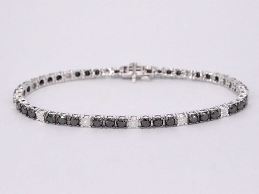 Witgouden tennisarmband rondom gezet met zwarte en witte diamanten