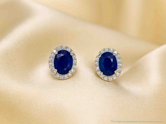 Witgouden entourage oorbellen met diamanten en saffier