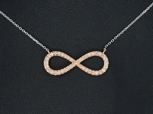 Witgouden collier met een rosegouden diamanten infinity hanger