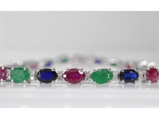 Witgouden tennisarmband met diamanten, saffier, robijn en smaragd
