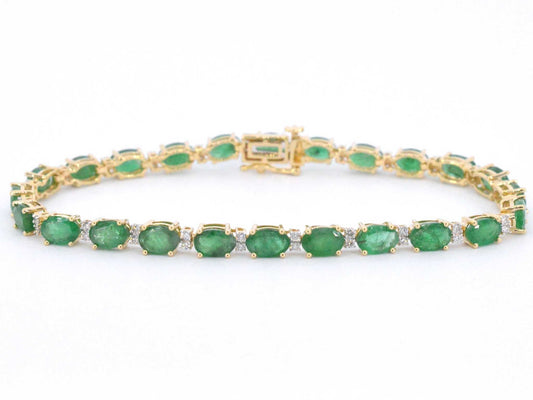 Geelgouden tennisarmband met diamanten en smaragden