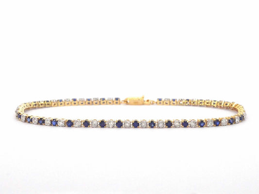 Gouden tennis armband met diamanten en saffieren