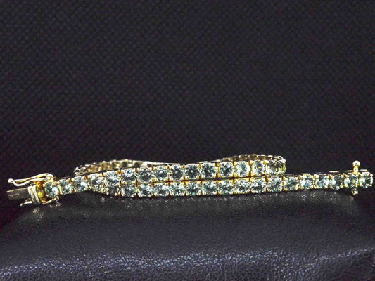 Gouden tennisarmband met 8.00 carat aan groene saffieren