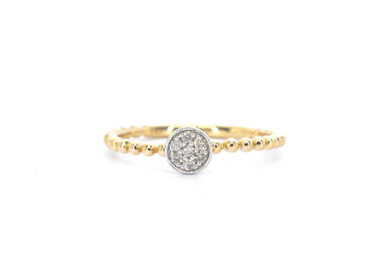 Gouden ring met centraal een rondje vol gezet met diamanten