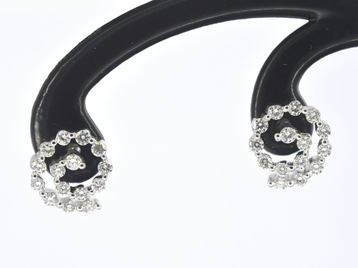 Witgouden oorbellen met diamanten in spiraal