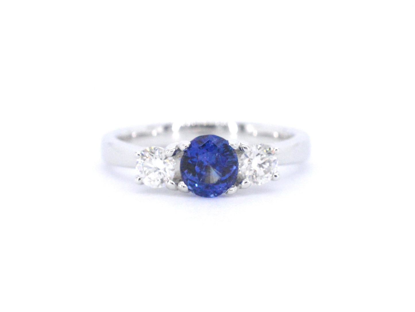Gouden ring met diamant en een blauwe saffier