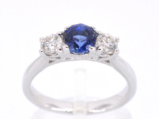 Gouden ring met diamant en een blauwe saffier