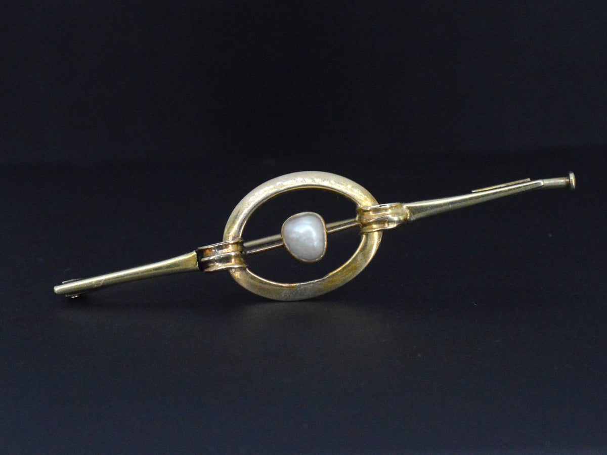 Gouden broche met orient parel