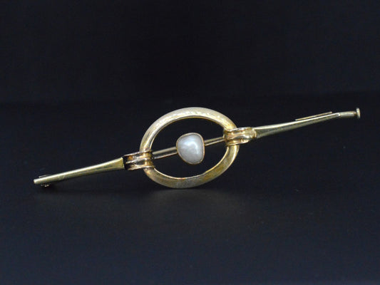 Gouden broche met orient parel